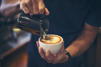 Barista making latte