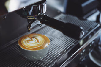 coffee cup on traditional coffee machine